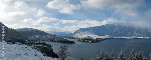 Panoramic winter view of Queenstown, Lake Wakatipu and the Remarkables mountain range in the Southern Alps on New Zealand's South Island