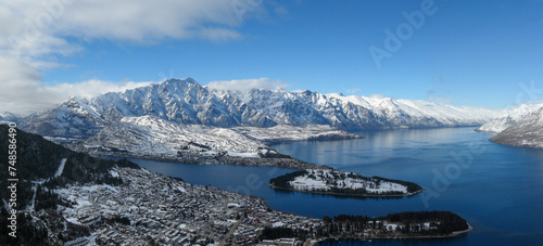 Aerial panoramic winter view of Queenstown, Lake Wakatipu and the Remarkables mountain range in the Southern Alps on New Zealand's South Island