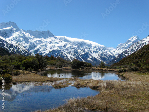 Southern Alps and Aoraki Mt Cook reflecting in the pristine Sealy Tarns on a beautiful day on New Zealand's South Island