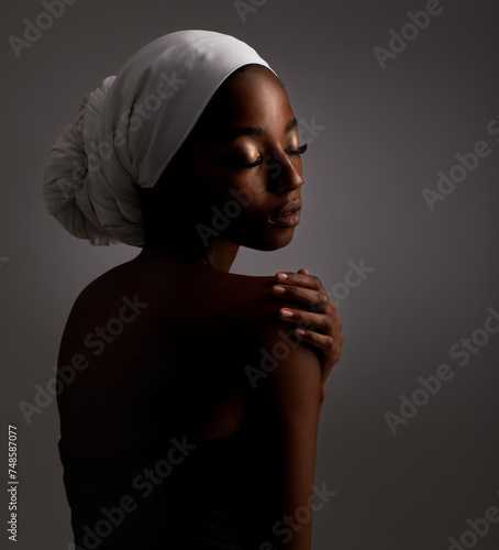 Beauty, relax and black woman in dark studio with head scarf, skincare and pride in culture. Cosmetics, skin glow and face of African model with dermatology, makeup and girl on grey background