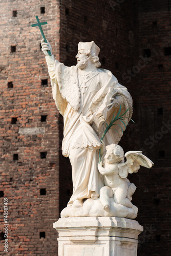 John of Nepomuk statue of a priest holding a cross with an angel at Milan Italy © magann