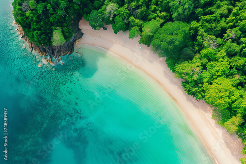 Aerial view of a tropical beach, Crystal clear turquoise water, White sandy shore, Lush greenery surrounding the beach, Peaceful and pristine environment