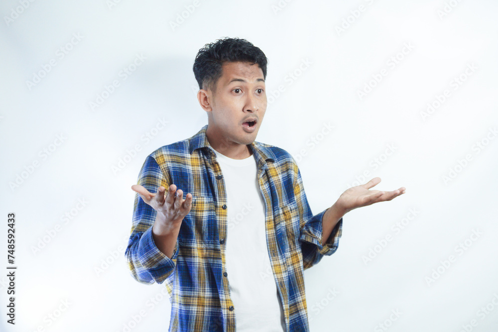 Adult Asian man showing shocked face expression isolated white backgroud Adult Asian man showing shocked face expression isolated white backgroud