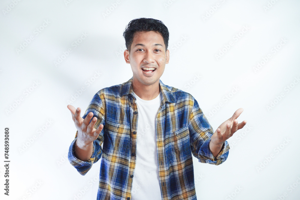 Adult Asian man smiling excited while open arms for greeting Adult Asian man smiling excited while open arms for greeting