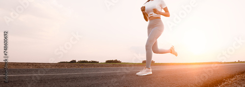 Runner running on old countryside road the land and scenery of a rural area. they running the surrounding.