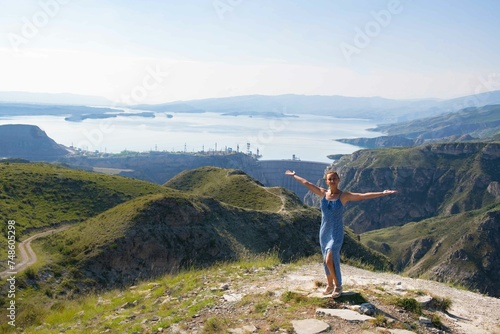 Spectacular Mountain and Lake View with a Young Woman in a Graceful Blue Dress