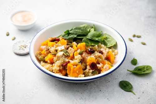 Healthy quinoa bowl with pumpkin and cranberry