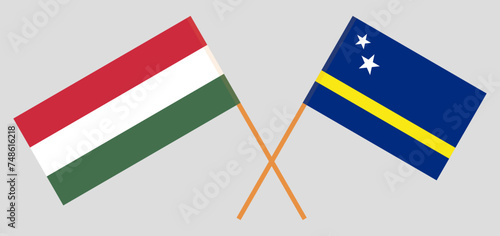 Crossed flags of Hungary and Country of Curacao. Official colors. Correct proportion