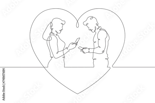 Online digital date for lovers. Couple on a date. People look at the phone screen. Digital age and lack of personal interaction.Internet addiction, social networking concept.)