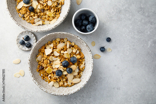 Homemade granola with coconut chips and berries photo