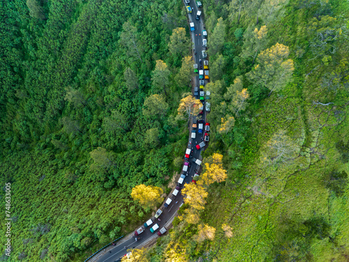 Aerial view of adventure tourist car for mountain Bromo vocalno viewpoint in parking area, Indonesia