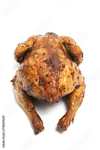 A whole delicious roasted chicken seasoned with herbs isolated on white background clipping path