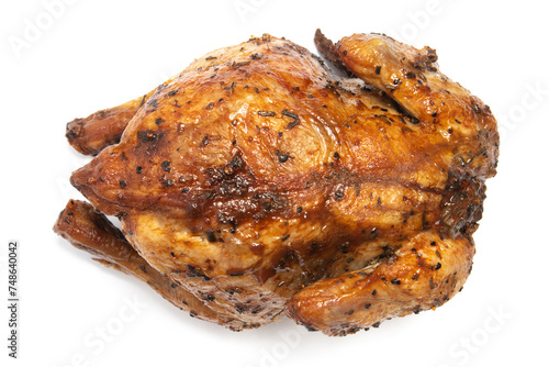 A whole delicious roasted chicken seasoned with herbs top view isolated on white background clipping path