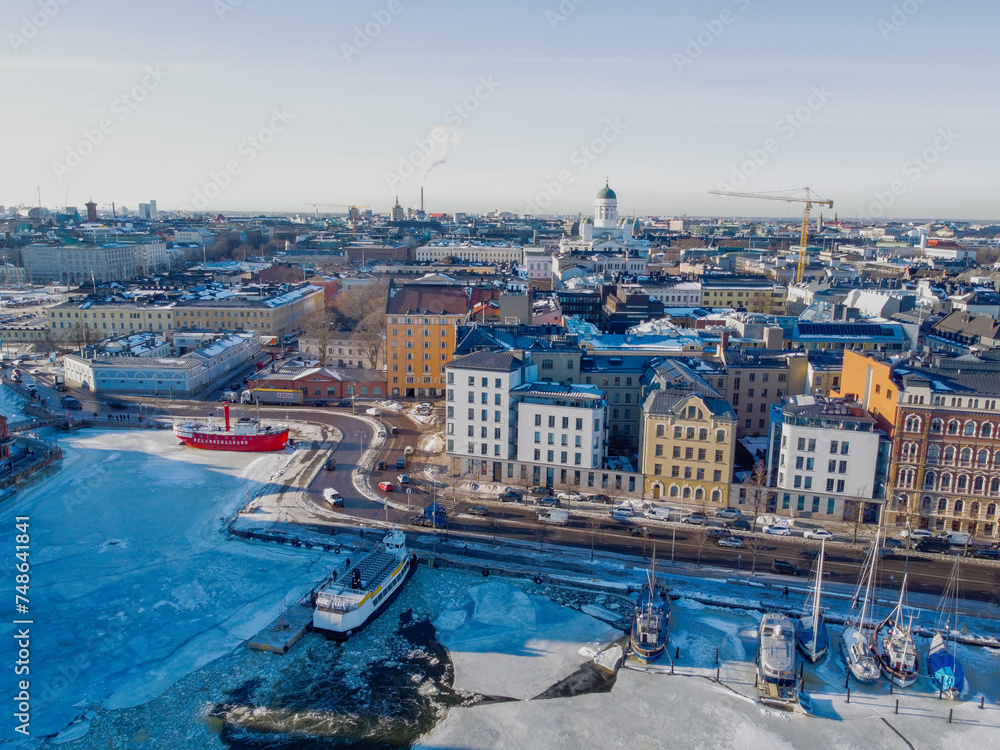 Aerial view of the harbour of Helsinki with the Cathedral in the background with frozen water