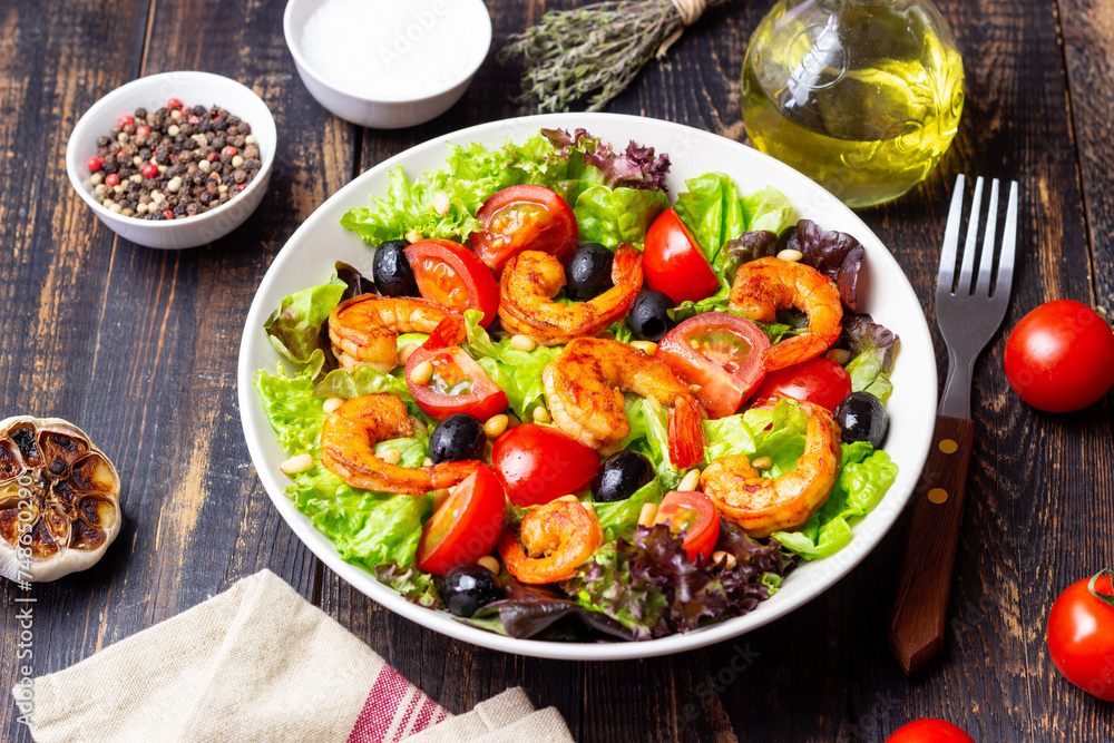 Salad with shrimps, tomatoes, olives and nuts. Healthy eating. Salad with shrimps, tomatoes, olives and nuts. Healthy eating.