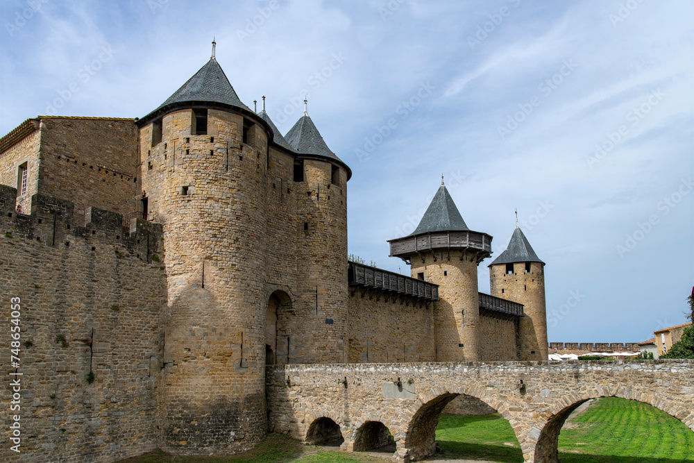 Low angle view of the entrance to Chateau Comtal in the city of Carcassonne, France, a medieval fortress from Gallo-Roman period and part of UNESCO list of World Heritage Sites