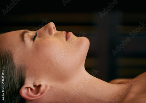 Woman  zen and calm in spa for peace or wellness  sleeping or daydreaming and relax to free tension. Female person  closeup and luxury for stress relief or rest for wellbeing with mindfulness.