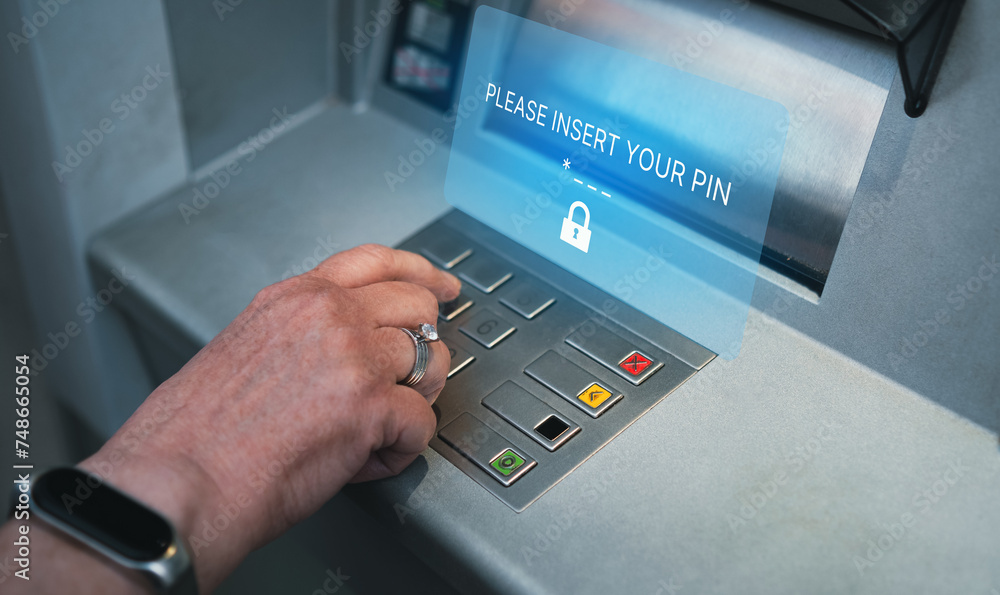 Woman using ATM with holographic interface for security PIN number on the keyboard automatic teller machine. Woman using ATM with holographic interface for security PIN number on the keyboard automatic teller machine.