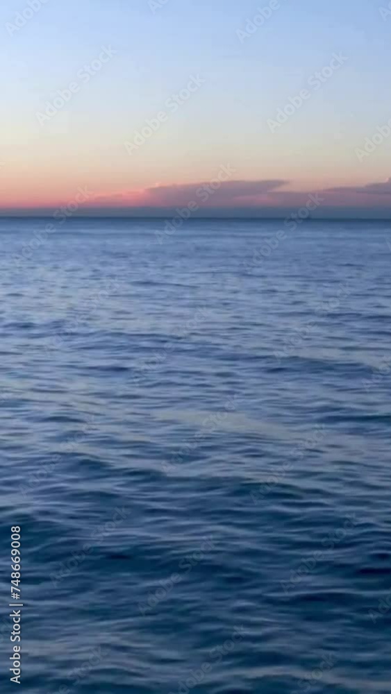 Aerial view of a blue sea water background and sun reflections. Aerial flying drone view. Blue water waves surface, beautiful background with copy space. Beautiful ocean waves Aerial view of a blue sea water background and sun reflections. Aerial flying drone view. Blue water waves surface, beautiful background with copy space. Beautiful ocean waves