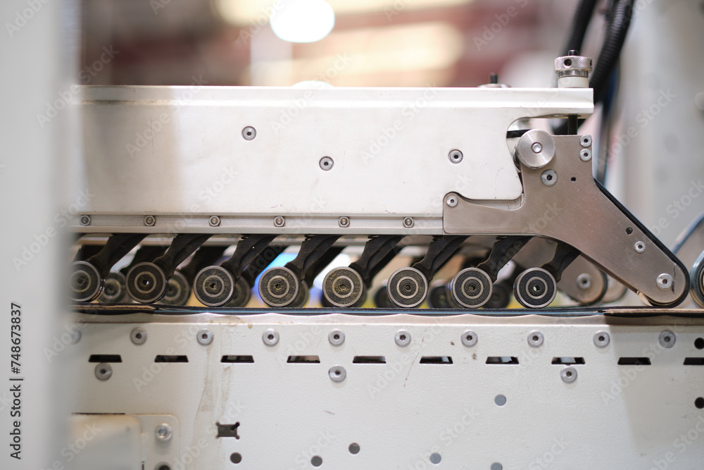 An empty industrial roller conveyor belt in a fully automated factory. roller conveyor to easily move heavy industrial goods around without the need for humans.future of industrial manufacture. An empty industrial roller conveyor belt in a fully automated factory. roller conveyor to easily move heavy industrial goods around without the need for humans.future of industrial manufacture.