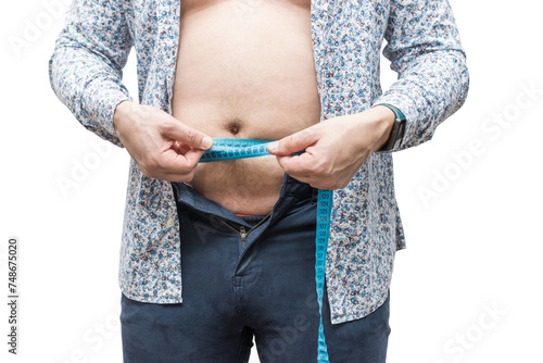 Overweight man with fat belly in unbuttoned tight trousers measure waist with measuring tape, isolated on transparent background