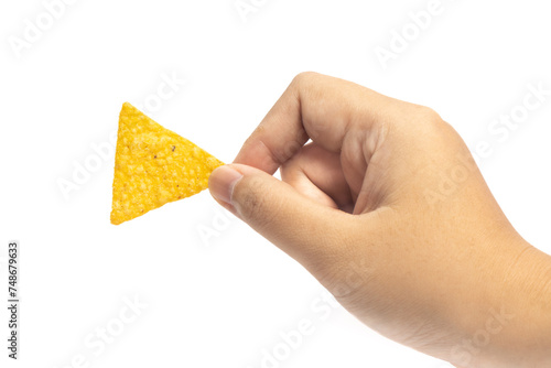 Hand holding crispy corn tortilla nachos chips isolated on white background clipping path