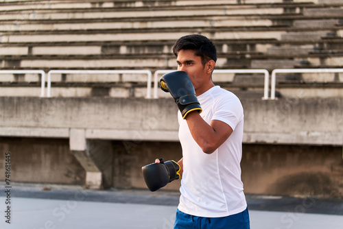 Young boxer training outdoors