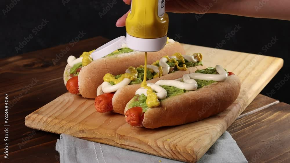 Chilean Typical Completo Food Hot dog with tomato, avocado palta and mayonnaise Selective Focus.