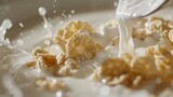 close-up of a bowl of milk with a single spoonful of cornflakes cereal ready to be enjoyed