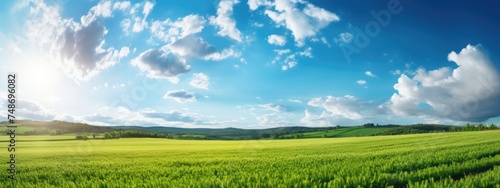 Spring landscape: fields and sky with clouds.