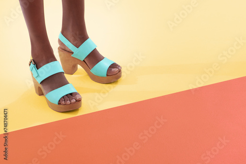 Female model, fashion and high heels for feet, floor and shoes with mock up space and colour block. Contemporary, stylish and trendy for funky black woman person, retro and vintage designer wear