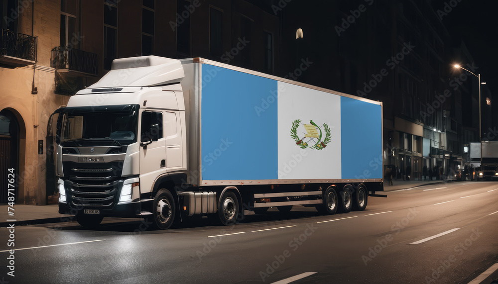 A truck with the national flag of Guatemala depicted carries goods to another country along the highway. Concept of export-import,transportation, national delivery of goods. A truck with the national flag of Guatemala depicted carries goods to another country along the highway. Concept of export-import,transportation, national delivery of goods.