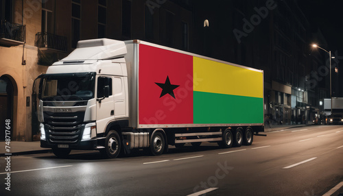 A truck with the national flag of Guinea-Bissau depicted carries goods to another country along the highway. Concept of export-import,transportation, national delivery of goods.