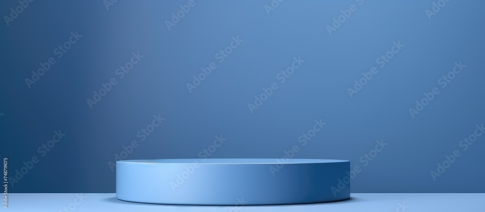A white round object is placed on top of a minimalistic table, creating a simple yet elegant display. The object is the focal point against a blue background, emphasizing its shape and texture. A white round object is placed on top of a minimalistic table, creating a simple yet elegant display. The object is the focal point against a blue background, emphasizing its shape and texture.