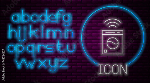 Glowing neon line Smart washer system icon isolated on brick wall background. Washing machine icon. Internet of things concept with wireless connection. Neon light alphabet. Vector