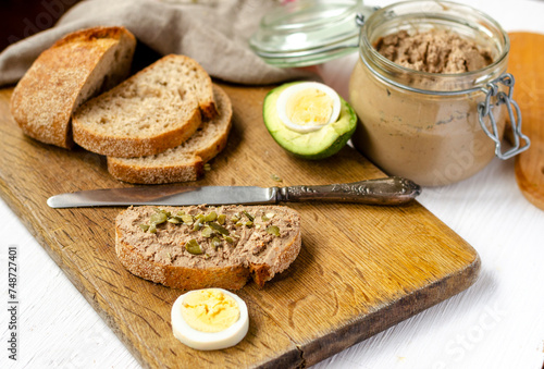 Slices of fresh bread with homemade pate from fresh duck liver.