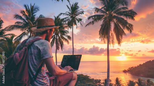 A man with a laptop on the beach near the sea. Remote work. Freelancing. photo