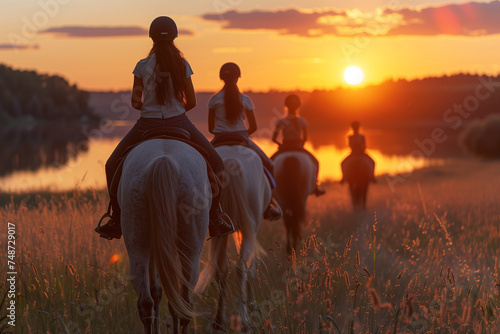 Group of People Riding on the Backs of Horses photo