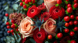 Beautiful bouquet of red and orange roses with green leaves and berries