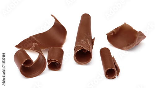 Many tasty chocolate curls isolated on white