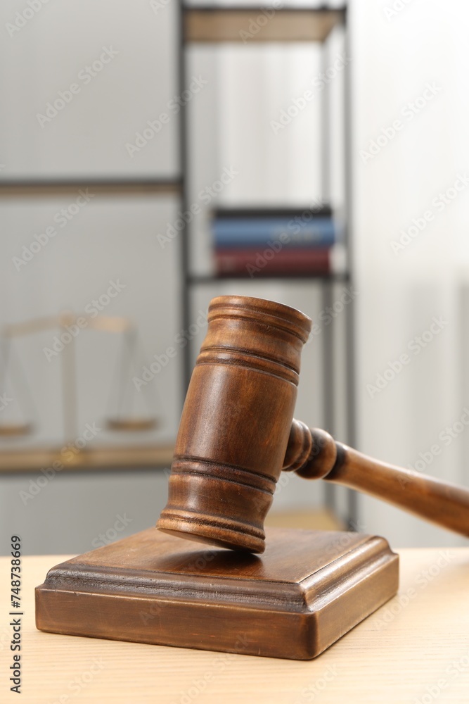 Wooden gavel and sound block on table indoors, closeup. Space for text Wooden gavel and sound block on table indoors, closeup. Space for text