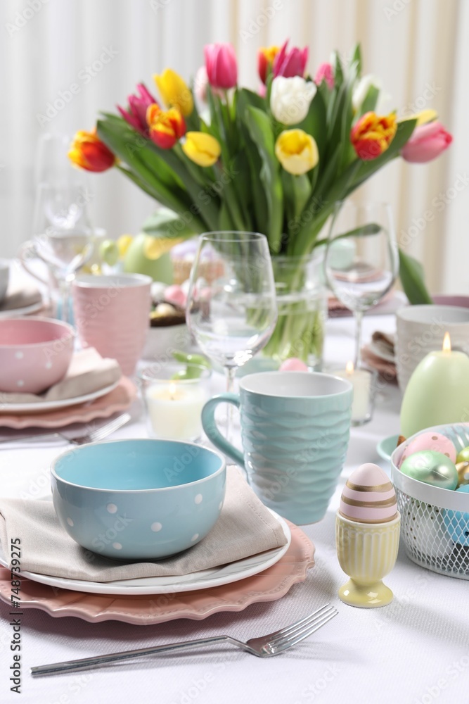 Festive table setting with beautiful flowers. Easter celebration Festive table setting with beautiful flowers. Easter celebration