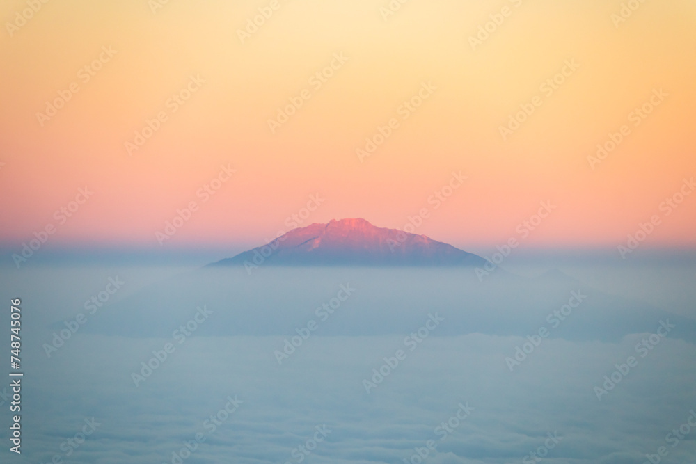 Mt. Meru’s Majestic Sunrise Above the Clouds