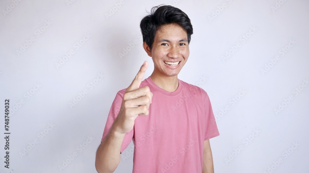 Excited Asian man with forward pointing gesture on Excited Asian man with forward pointing gesture on