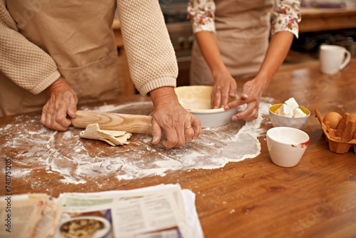 Hands, dough and people baking in kitchen of home together closeup with ingredients for recipe. Cooking, food or flour with baker and chef in apartment for fresh pastry preparation from above