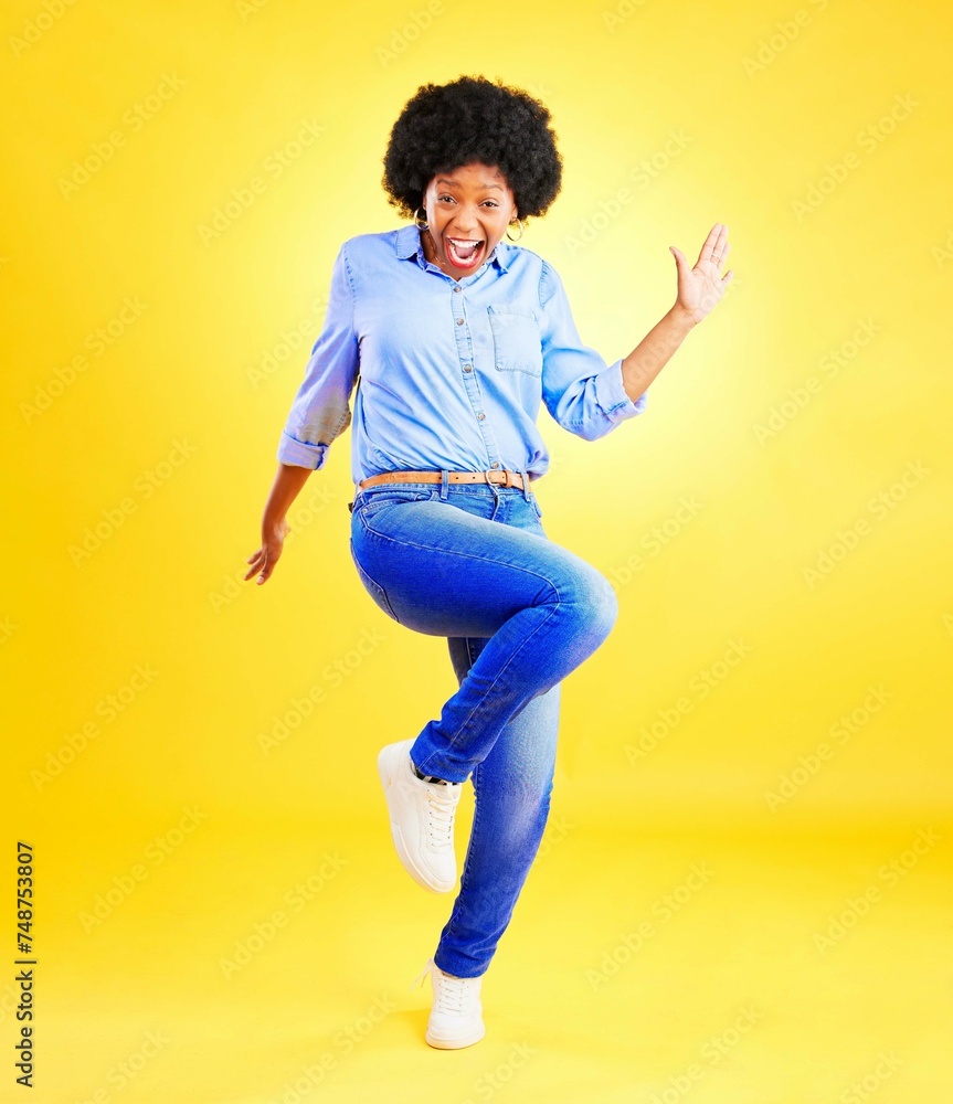 Happy, excited and a woman in studio with fun energy, positive attitude and action. Portrait of African model person isolated on yellow background for freedom dance, winner or celebration of success Happy, excited and a woman in studio with fun energy, positive attitude and action. Portrait of African model person isolated on yellow background for freedom dance, winner or celebration of success