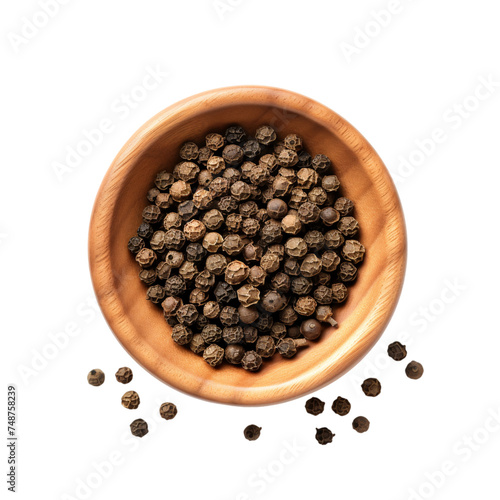 black pepper in a wooden bowl - top view