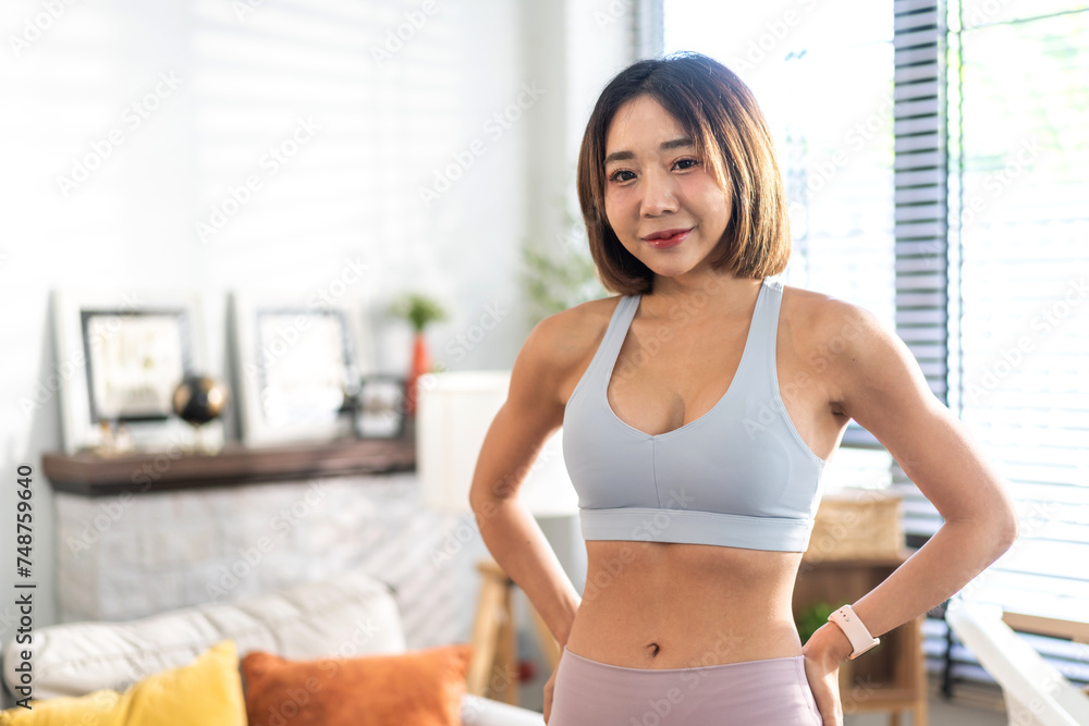 Portrait of sport slim fit strength asian woman training in sportswear relax and practicing yoga, fitness, exercise, wellness, workout, sport at home.Diet concept.Fitness and healthy lifestyle