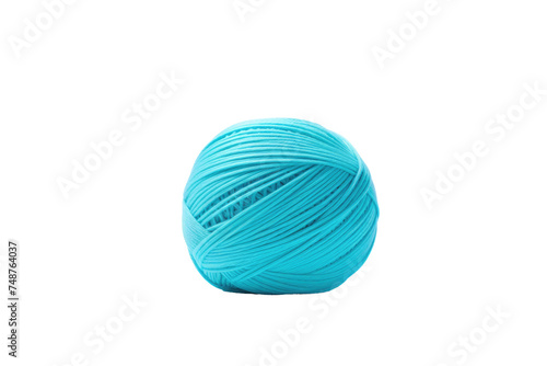 A ball of blue yarn sits on a plain white background, showcasing the vibrant color and texture of the yarn. The round shape of the ball is neatly wound.