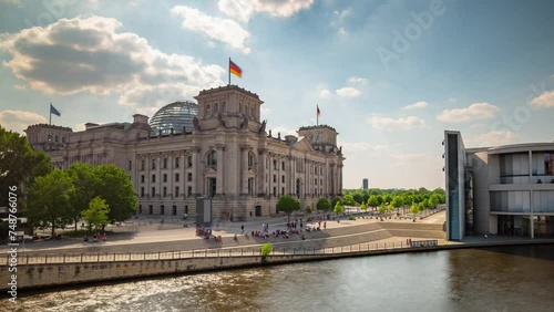 BERLIN, GERMANY - MARCH 1, 2024: Timelapse hyperlapse view of Berlin Reichstag, famous historical social touristic historical landmark. photo